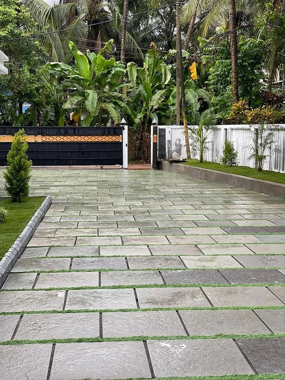 Residential entrance with flag paving and kerb edging